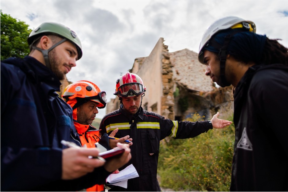 A chimney inspection team discussing plans. 